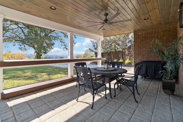 view of patio with ceiling fan and outdoor dining area