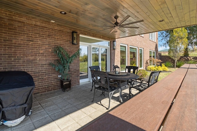 view of patio with ceiling fan, outdoor dining space, and grilling area