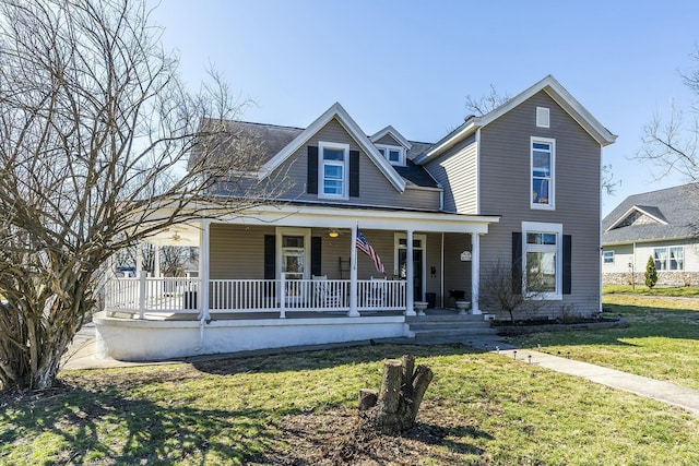 view of front facade featuring a front lawn and a porch