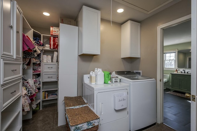 washroom featuring recessed lighting, cabinet space, attic access, and washing machine and clothes dryer