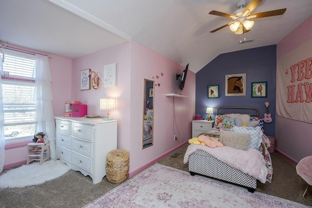 carpeted bedroom featuring a ceiling fan, multiple windows, vaulted ceiling, and baseboards