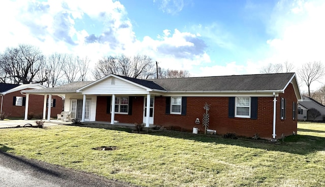 ranch-style house with a porch, brick siding, and a front lawn