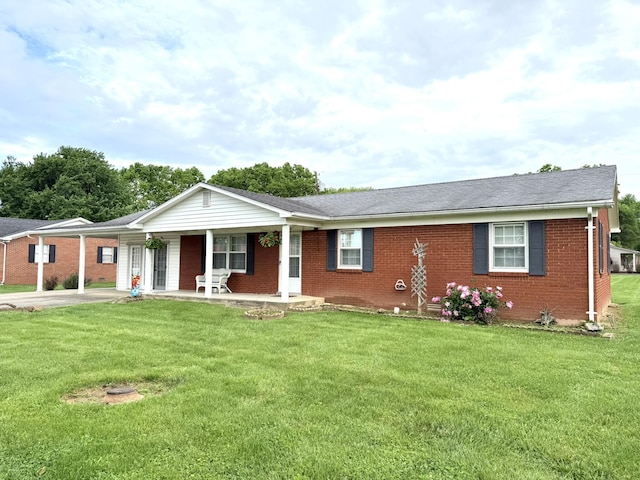 44 Pine St, Crab Orchard, KY 40419 - ranch-style home with brick siding, a porch, and a front lawn