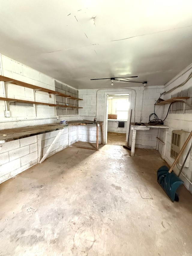 44 Pine St, Crab Orchard, KY 40419 - below grade area featuring a workshop area, heating unit, and concrete block wall