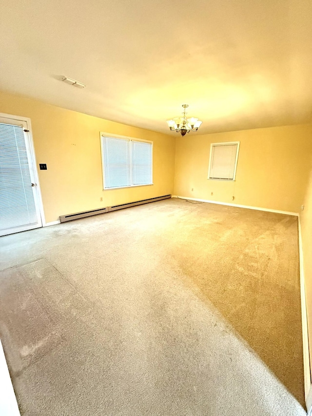 44 Pine St, Crab Orchard, KY 40419 - carpeted empty room featuring a chandelier, a baseboard heating unit, and baseboards