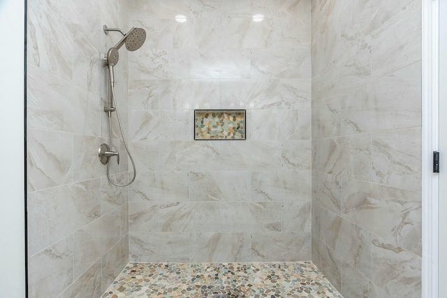 full bath with tiled shower