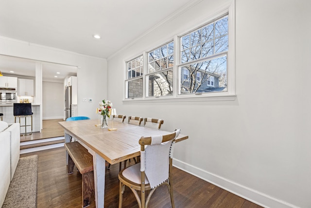 dining area with ornamental molding, recessed lighting, dark wood finished floors, and baseboards