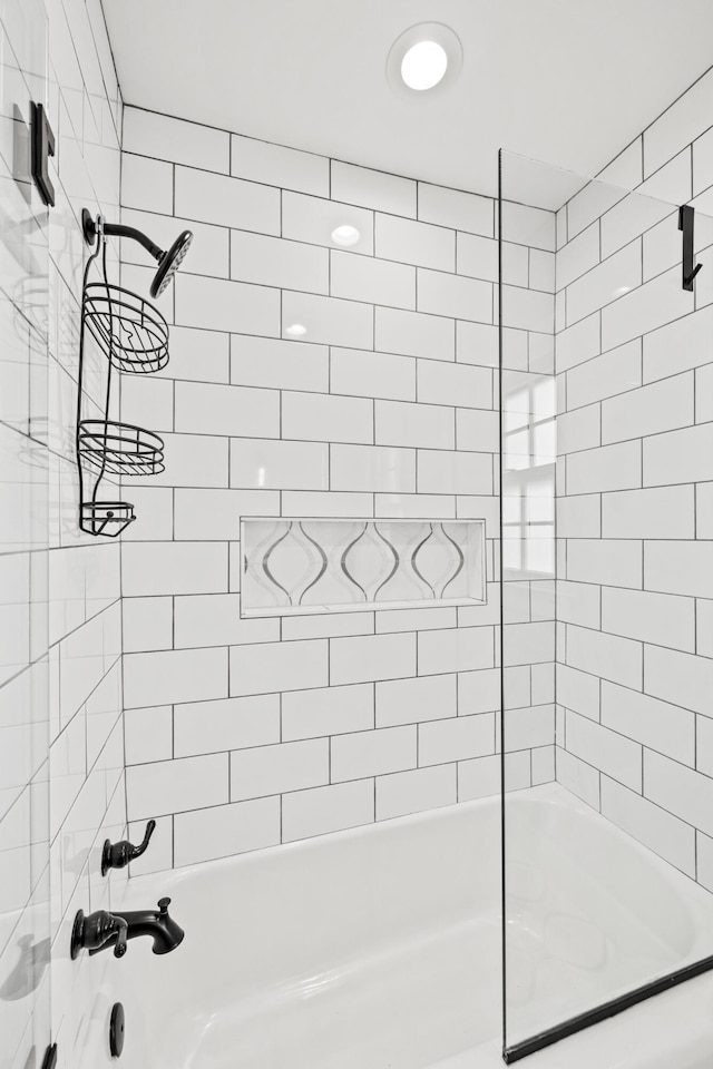 bathroom with bathing tub / shower combination