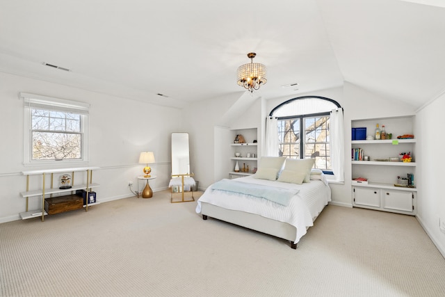 carpeted bedroom featuring a chandelier, visible vents, vaulted ceiling, and baseboards