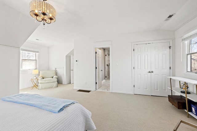 carpeted bedroom featuring baseboards, multiple windows, visible vents, and an inviting chandelier