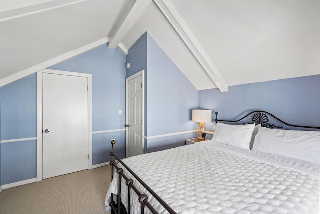 bedroom featuring carpet flooring, lofted ceiling with beams, and baseboards