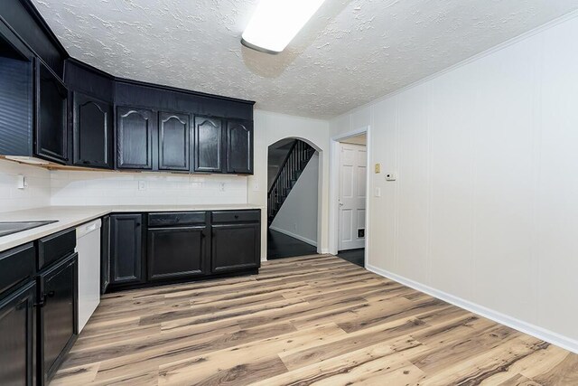 spare room with dark wood-style flooring, ceiling fan, and baseboards