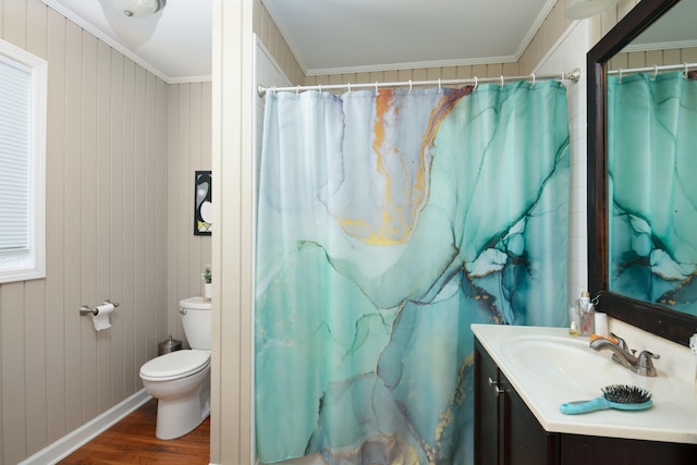 bathroom with wood finished floors, vanity, and crown molding