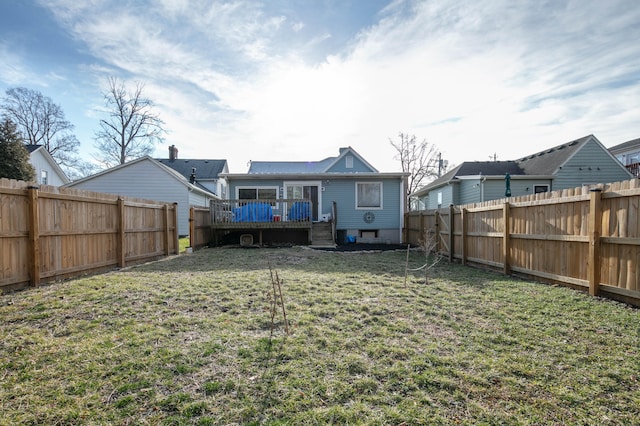 view of yard featuring a fenced backyard and a wooden deck