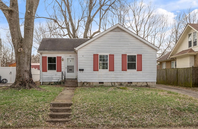 bungalow-style house featuring crawl space, fence, a front lawn, and entry steps