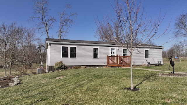 view of front of home featuring a deck, a front yard, cooling unit, and metal roof