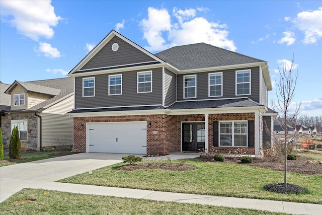 view of front of home with brick siding, roof with shingles, a front yard, a garage, and driveway