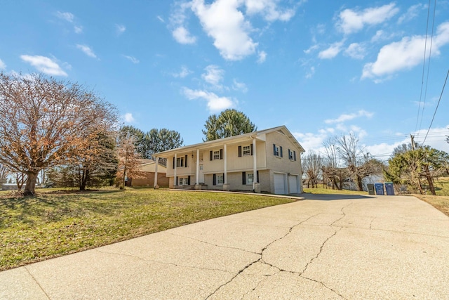 view of front of home featuring aphalt driveway, covered porch, an attached garage, and a front lawn