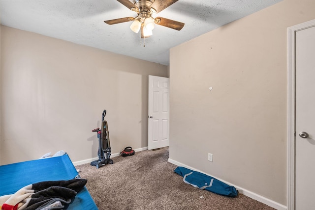 workout room with carpet floors, ceiling fan, a textured ceiling, and baseboards