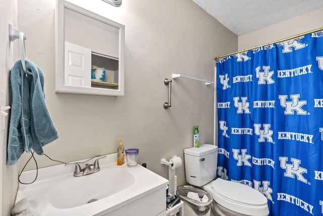 full bath with toilet, curtained shower, a textured ceiling, and vanity