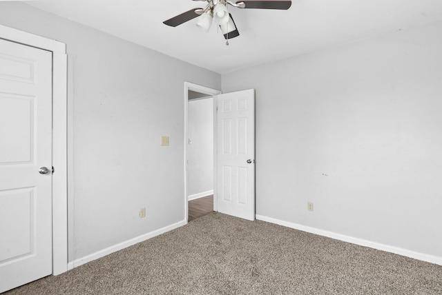 unfurnished bedroom with carpet flooring, ceiling fan, and baseboards