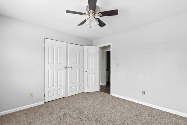 unfurnished bedroom featuring carpet floors, ceiling fan, and baseboards