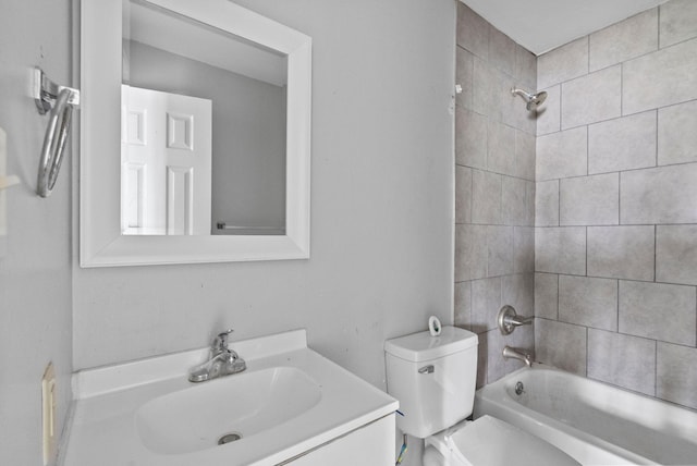 bathroom with toilet, shower / bathtub combination, and vanity