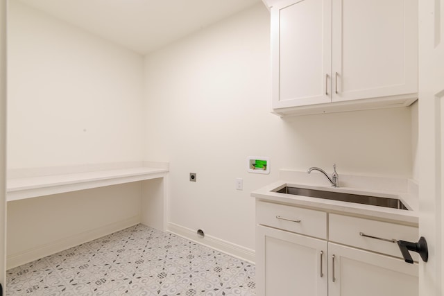 laundry area with cabinet space, baseboards, hookup for a washing machine, electric dryer hookup, and a sink