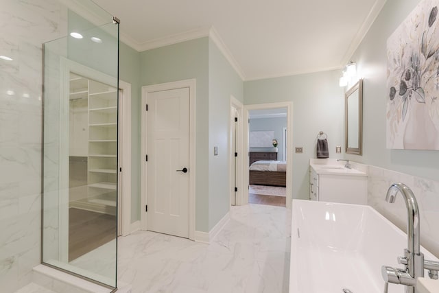 full bath with marble finish floor, ornamental molding, a soaking tub, and connected bathroom