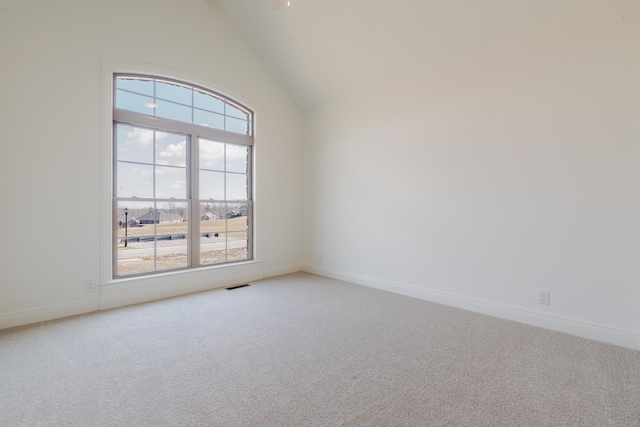 empty room with light colored carpet, visible vents, and baseboards