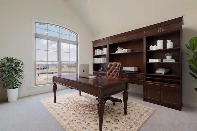 office area featuring light carpet and high vaulted ceiling