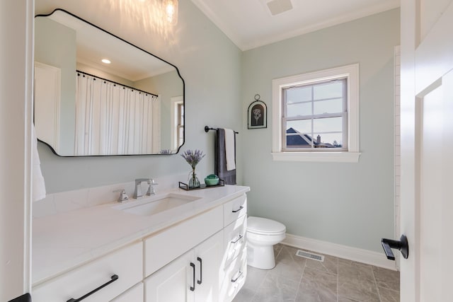 full bathroom featuring visible vents, toilet, ornamental molding, vanity, and baseboards