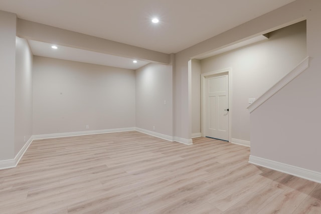 unfurnished room with recessed lighting, light wood-type flooring, and baseboards