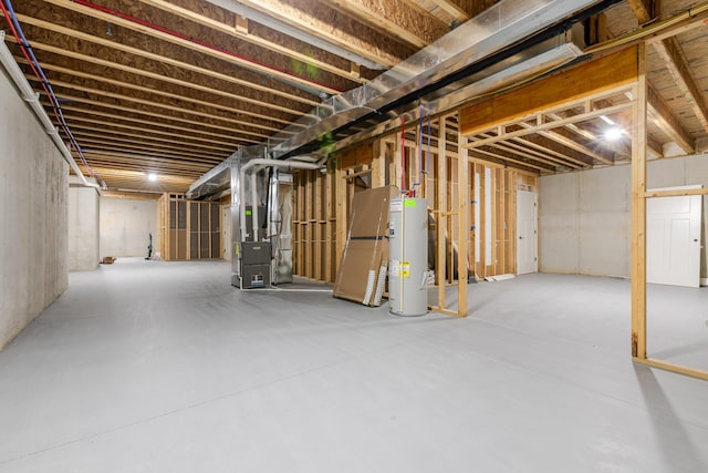 unfinished basement with water heater and heating unit