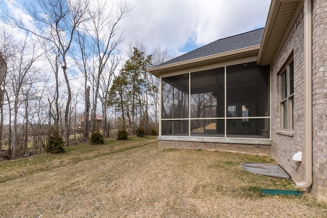 view of yard featuring a sunroom