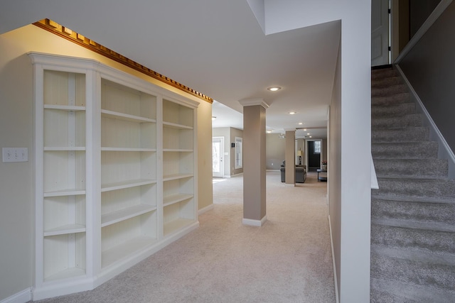 hallway with baseboards, stairway, carpet, built in shelves, and recessed lighting