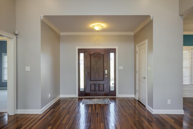 foyer with plenty of natural light, hardwood / wood-style flooring, and baseboards