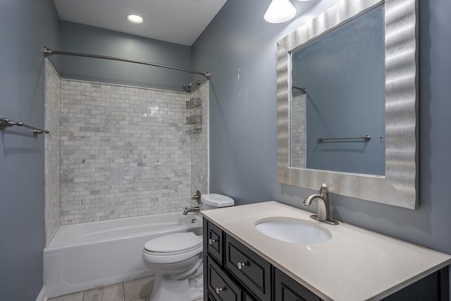 bathroom with shower / tub combination, vanity, and toilet