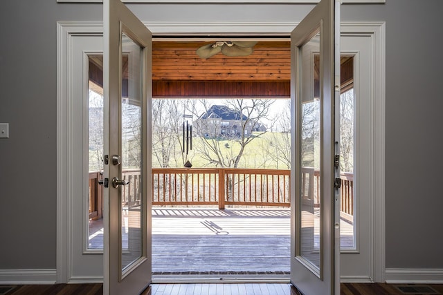 entryway with french doors, wood finished floors, visible vents, and baseboards