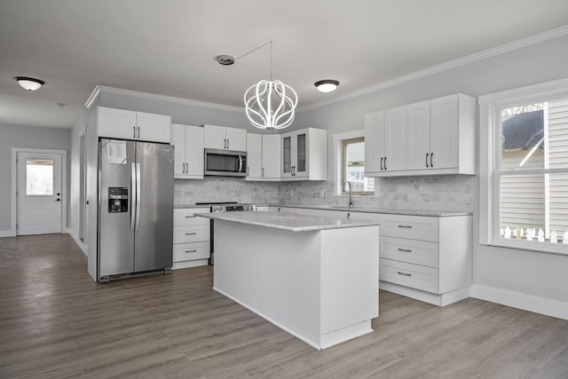 213 Richmond St, Lancaster, KY 40444 - kitchen featuring white cabinetry, an inviting chandelier, a sink, and appliances with stainless steel finishes