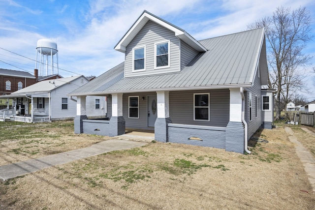 view of front of house featuring covered porch and metal roof