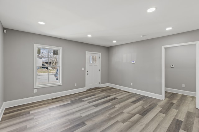 foyer entrance featuring recessed lighting, baseboards, and wood finished floors