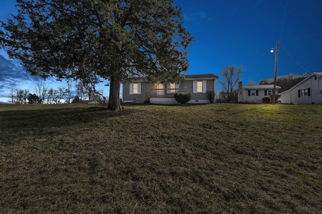 view of front facade with a front lawn and crawl space