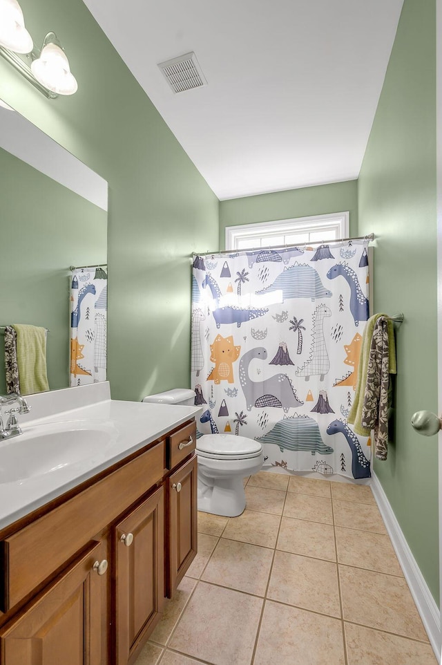 bathroom with visible vents, baseboards, toilet, tile patterned flooring, and vanity