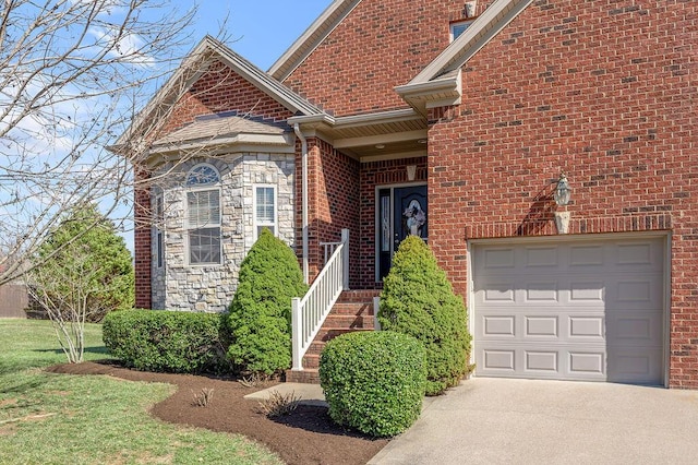 exterior space featuring a garage, stone siding, and brick siding