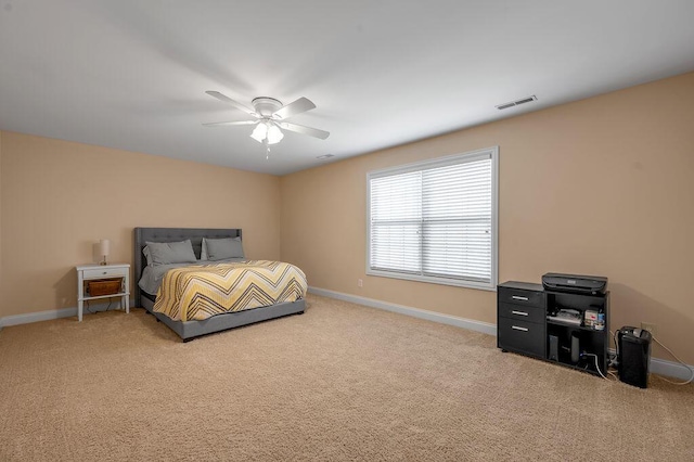 bedroom featuring light colored carpet, visible vents, and baseboards