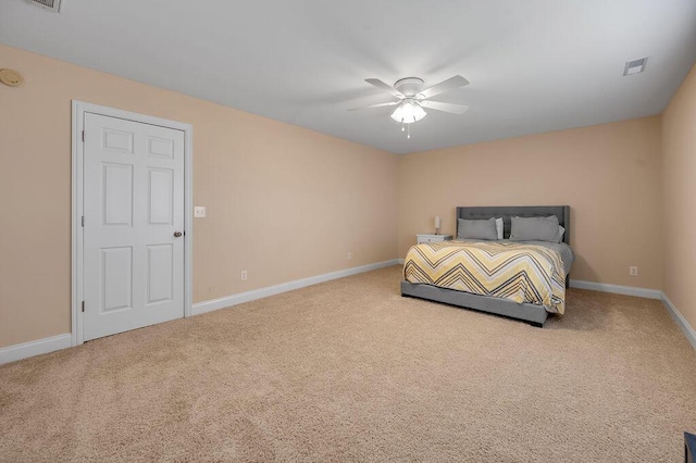 unfurnished bedroom featuring carpet floors, visible vents, ceiling fan, and baseboards