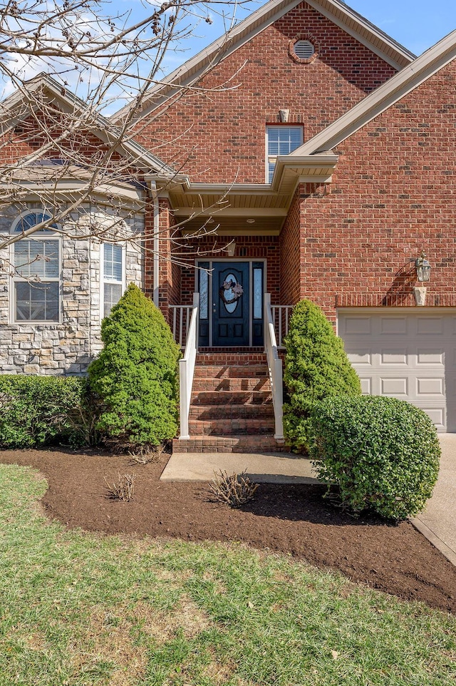 property entrance with stone siding and brick siding