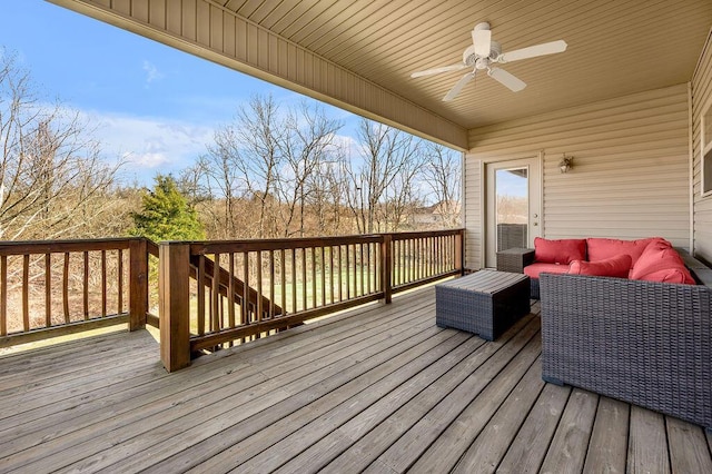 wooden terrace featuring an outdoor hangout area and a ceiling fan