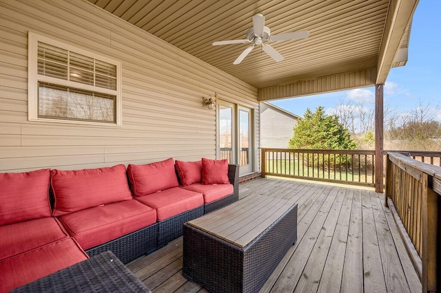 wooden terrace featuring ceiling fan and an outdoor hangout area